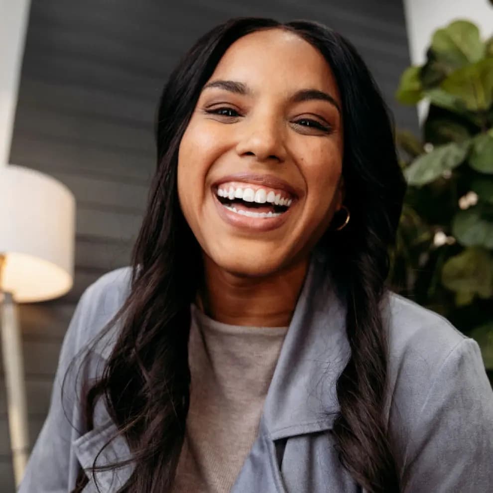 Woman smiling after her Invisalign® treatment